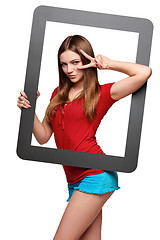 Image showing Female looking through the frame giving thumb up