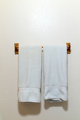 Image showing Two white towels on wall