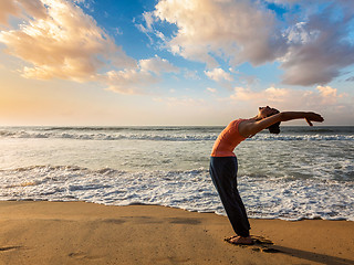 Image showing Woman doing yoga Sun salutation Surya Namaskar 