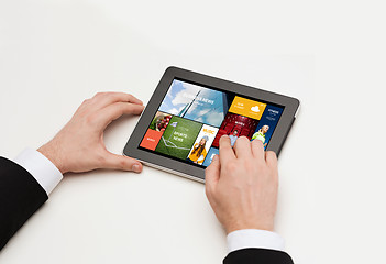 Image showing close up of man hands with web pages on tablet pc