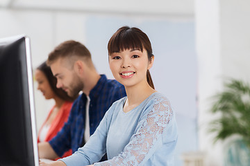 Image showing happy creative team or students working at office