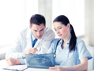 Image showing two doctors looking at x-ray