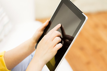 Image showing close up of woman hand with tablet pc at home