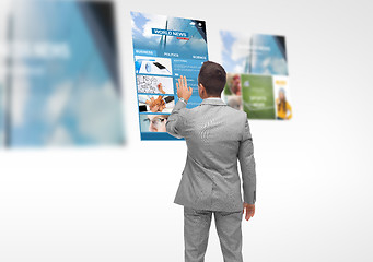 Image showing man with virtual projection of business news