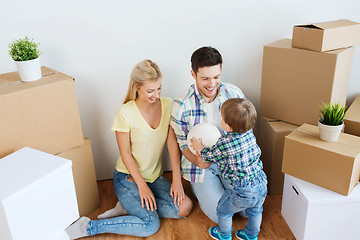 Image showing happy family moving to new home and playing ball