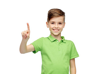 Image showing happy boy in green polo t-shirt pointing finger up