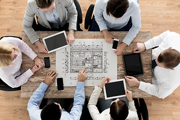 Image showing business team or architects with blueprint