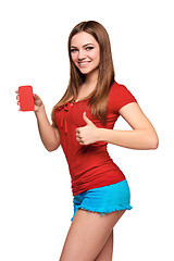 Image showing smiling teen girl holding blank credit card