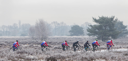 Image showing EPE, THE NETHERLANDS - MARCH 5, 2016: Cyclists under winter skie