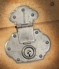 Image showing Old canvas trunk lock close up