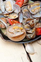 Image showing fresh clams on an iron skillet