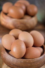 Image showing Fresh eggs at wooden plate 