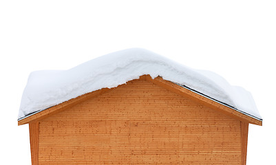 Image showing Wooden house with snow on roof