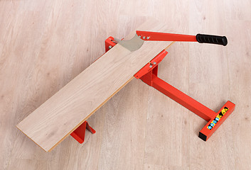 Image showing Red tool for cutting laminate