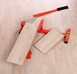 Image showing Red tool for cutting laminate