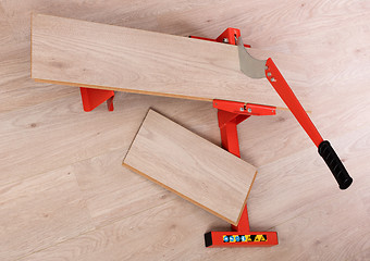 Image showing Red tool for cutting laminate