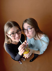 Image showing Teen girls drinking together