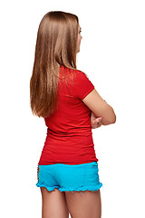 Image showing Back view of young female looking at blank copy space