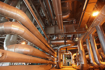 Image showing Equipment, cables and piping as found inside of a modern industr