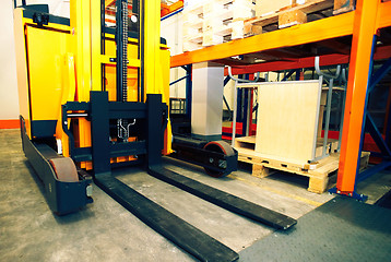 Image showing Shelves, racks and forklift  with pallets in distribution wareho