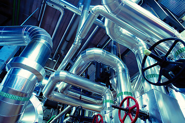 Image showing Equipment, cables and piping as found inside of a modern industr