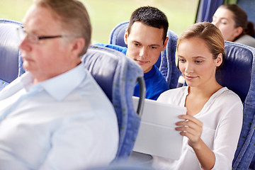 Image showing happy couple with tablet pc in travel bus