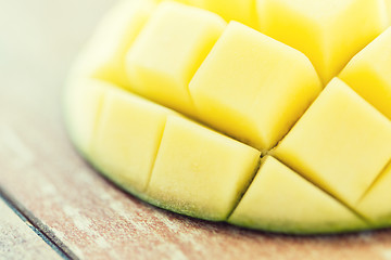 Image showing close up of ripe mango slice on table