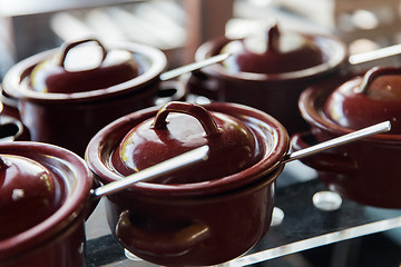 Image showing close up of hot food pots at restaurant