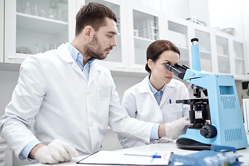 Image showing young scientists making test or research in lab