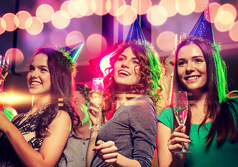 Image showing smiling friends with glasses of champagne in club