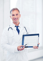 Image showing male doctor with stethoscope showing cardiogram