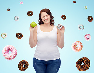 Image showing happy plus size woman choosing apple or cookie