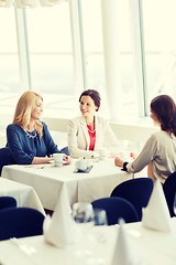 Image showing women drinking coffee and talking at restaurant