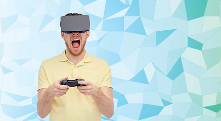 Image showing angry man in virtual reality headset with gamepad