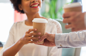 Image showing close up of happy woman hand taking coffee cup