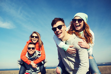 Image showing happy friends in shades having fun outdoors