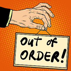 Image showing Hand holding a sign out of order