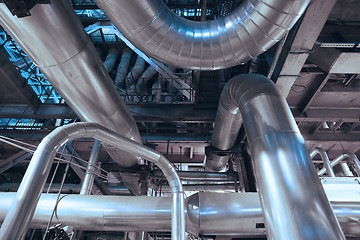 Image showing Equipment, cables and piping as found inside of a modern industr