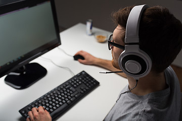 Image showing close up of man playing computer video game