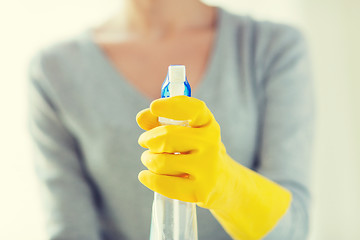 Image showing close up of happy woman with cleanser spraying