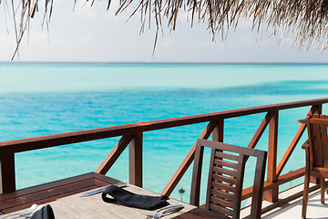 Image showing outdoor restaurant terrace with furniture over sea