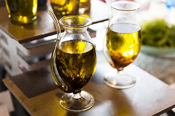 Image showing close up of glass jug with extra vergin olive oil