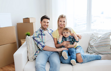 Image showing happy family with boxes moving to new home