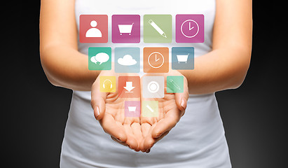 Image showing close up of womans hands with app menu icons