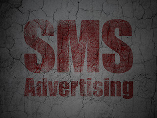 Image showing Advertising concept: SMS Advertising on grunge wall background