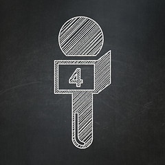 Image showing News concept: Microphone on chalkboard background