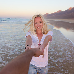 Image showing Romantic couple having fun on beach.