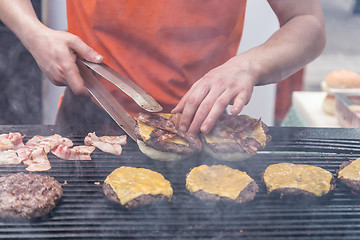 Image showing Beef burgers ready to serve on food stall.