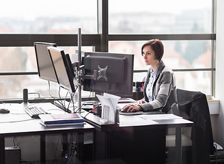 Image showing Business woman working in corporate office.