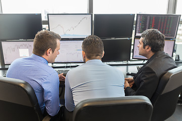 Image showing Business people looking at computer screens.